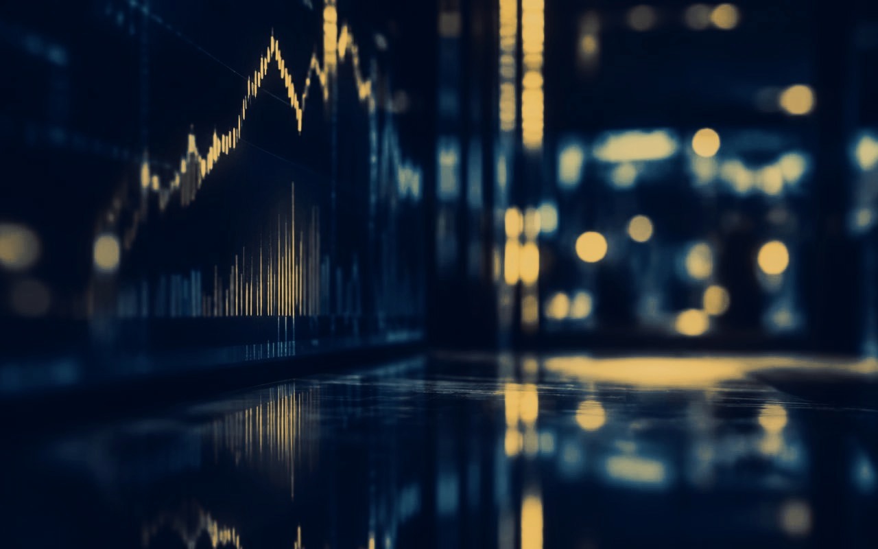 Market data displays reflected in a dark interior