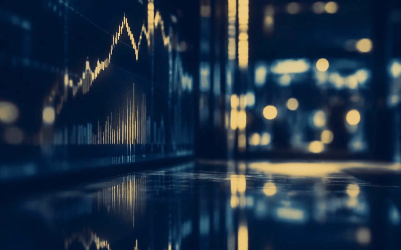 Market data displays reflected in a dark interior